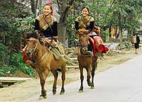 Horsewomen from a local Tay ethnic minority village